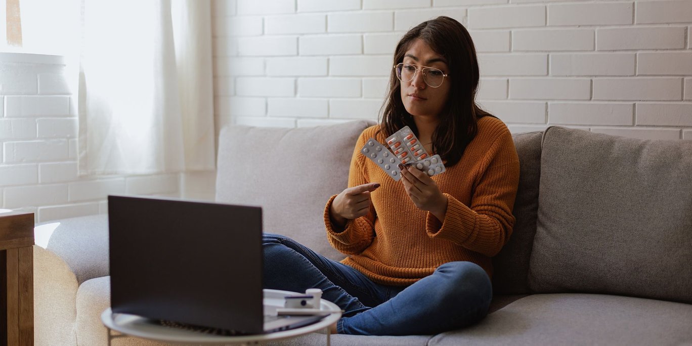 The Truth About Getting the Abortion Pill Through Telehealth A woman learning the truth about getting the abortion pill through Telehealth